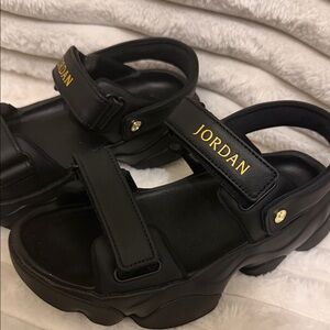 Jordan Black Sandals with Gold Logo